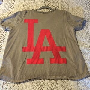 NWOT from boutique tan color raw hem sleeve LA in neon pink top size medium